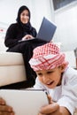 Happy Arabic child at home with his mother