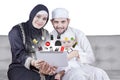 Happy Arabic family shopping online on tablet