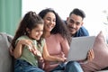 Happy Arabic Family Of Three Making Video Call With Laptop At Home Royalty Free Stock Photo