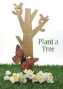 Happy Arbor Day, Plant a Tree greeting for last Friday in April, with wood tree, carved birds, butterfly and green grass