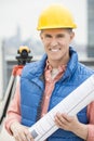 Happy Architect Holding Rolled Up Blueprint Royalty Free Stock Photo