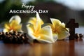 Happy Ascension Day concept with wooden rosary beads, Jesus Christ holy crucifix, flowers and sun rays over the holy cross.