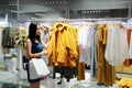 Happy Asia Chinese Eastern oriental young trendy woman girl shopping in mall with bags pick out clothes Royalty Free Stock Photo