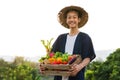 Happy Asia farmer smiling while hold various of vegetable product