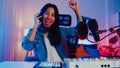 Happy asia girl dj play launchpad synthesizer keyboard sound mixer wear headphone and performance music online live talk with Royalty Free Stock Photo