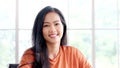 Happy asia girl, Portrait of young asian woman smiling and looking at camera in casual lifestyle while sitting at home office