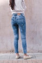 Happy Asia woman in bright blue skinny crop jeans, sky blue jeans