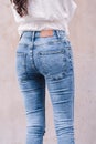 Happy Asia woman in bright blue skinny crop jeans, sky blue jeans