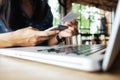 Happy Asia woman doing shopping online and use laptop shopping Royalty Free Stock Photo