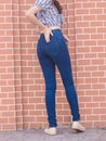 Happy Asia woman in navy blue skinny jeans, dark blue jeans