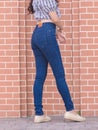 Happy Asia woman in navy blue skinny jeans, dark blue jeans