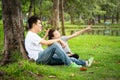 Happy asian adult man and cute child girl with love,hugging and smiling in summer,hand of father caress his hair little beautiful Royalty Free Stock Photo