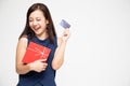 Happy Asian beautiful woman holding red gift box and credit card on hand Royalty Free Stock Photo