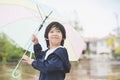 Happy asian boy holding colorful umbrella playing in the park Royalty Free Stock Photo