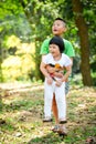 Happy Asian boy holding his sister in the park Royalty Free Stock Photo