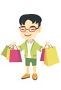 Happy asian boy holding shopping bags.