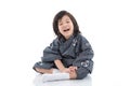 Happy asian boy in kimono sitting Royalty Free Stock Photo