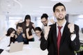 Happy asian business people looking at laptop computer with their manager standing at front Royalty Free Stock Photo