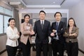 Happy Asian Business Team Standing with Confidence in the Office Meeting Room Royalty Free Stock Photo