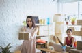 Happy asian business woman owner holding parcel and working together,Female smiling start up entrepreneur SME online at home offic Royalty Free Stock Photo