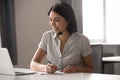 Happy asian woman wearing headset, helping client with problem. Royalty Free Stock Photo