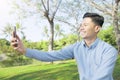 Happy asian businessman with smile taking a self picture Royalty Free Stock Photo