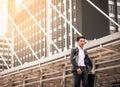 Happy Asian businessman walking along the street Royalty Free Stock Photo