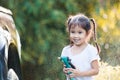 Happy asian child girl help parent washing car Royalty Free Stock Photo