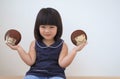 Happy asian child girl playing with toy in white wall room, Feelings and emotions of kid concept