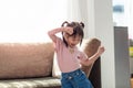 Happy Asian child having fun and dancing in a room Royalty Free Stock Photo