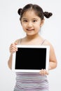 Happy Asian child holding tablet computer Royalty Free Stock Photo