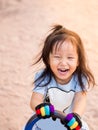 Happy Asian child on a seesaw