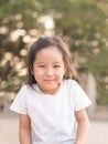 happy Asian child on a seesaw in sunset light