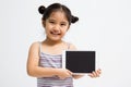 Happy Asian child with tablet computer Royalty Free Stock Photo