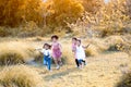 Happy asian children run and play with toy paper airplane