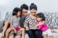 Happy Asian Chinese Family Playing with Digital Tablet Together Royalty Free Stock Photo