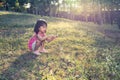 Happy Asian Chinese Little Girl Picking Wild Flowers Royalty Free Stock Photo