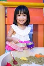 Happy Asian Chinese Little Girl Playing Kinetic Sand Indoor Royalty Free Stock Photo