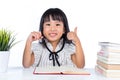 Happy Asian Chinese little office lady reading with thumbs up Royalty Free Stock Photo