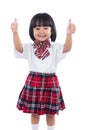 Happy Asian Chinese little student girl showing thumbs up