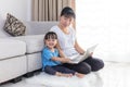 Happy Asian Chinese mother and daughter using laptop at home Royalty Free Stock Photo