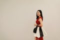 Happy Asian Chinese white woman shopping bags in a mall store casual buyer smile laugh consumption on sale promotion VIP