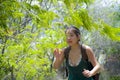 Happy Asian Chinese woman trekking and backpacker hiking excursion trip on tropical mountain enjoying nature smiling cheerful Royalty Free Stock Photo