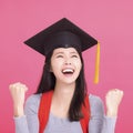 Happy Asian  college student in Graduation cap  with success gesture Royalty Free Stock Photo