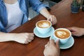 Happy Asian couple in blue jean have hot latte coffee Royalty Free Stock Photo