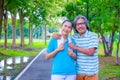 They are happy Asian couple.They give a big hug together after Jogging in park. Royalty Free Stock Photo