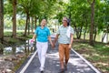 They are happy Asian couple.They give a big hug together after Jogging in park. Royalty Free Stock Photo