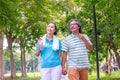 They are happy Asian couple.They give a big hug together after Jogging in park. Royalty Free Stock Photo