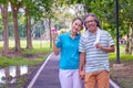 They are happy Asian couple.They give a big hug together after Jogging in park. Royalty Free Stock Photo