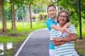 They are happy Asian couple.They give a big hug together after Jogging in park. Royalty Free Stock Photo